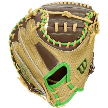 A close-up of a Wilson A1000 CM33 DUBAI 33″ Baseball Catcher’s Mitt (WBG25101RT33) by Wilson, featuring brown and tan leather with green accents and yellow laces, highlighting the glove’s detailed texture.