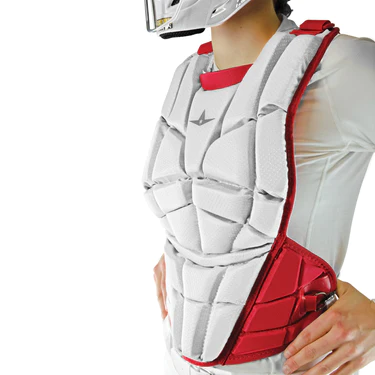 A person wearing a white and red protective chest guard over a white shirt, with a helmet partially visible, likely for a sport such as baseball or softball.
