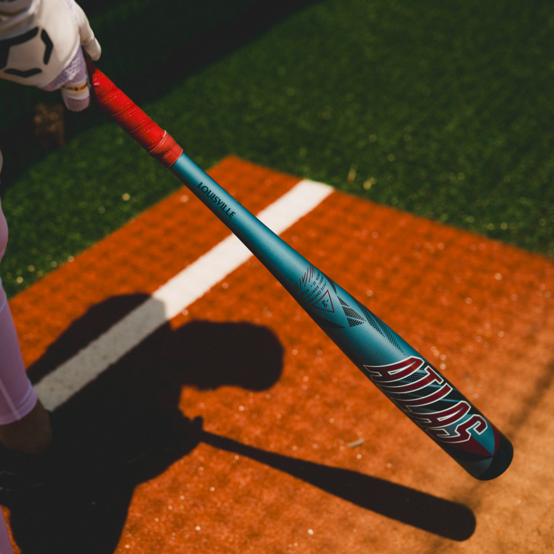 A person holding the 2026 Louisville Slugger Atlas (-3) BBCOR Baseball Bat (model WBL4116010), a one-piece alloy bat from Louisville Slugger.