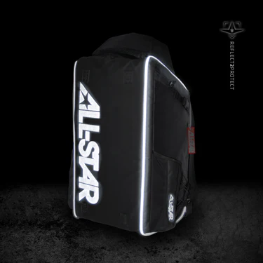 The All Star MVP PRO Series Catcher's Backpack (BBCBP) in black features ALL STAR in bold white letters, reflective trim, multiple compartments including a glove vault, and the Reflect2Protect logo on the right, displayed against a dark background.