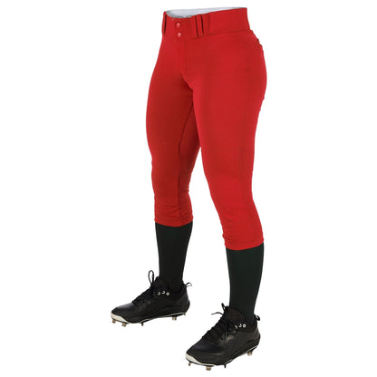 A person shown from the waist down wearing Champro Sports Girl's Low Rise Tournament Fastpitch Softball Pants (BP11G) in bright red with pro-style tunnel belt loops, paired with black knee-high socks and black cleats, against a white background.