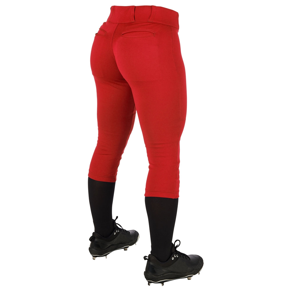 A person wearing Champro Sports Women's Low Rise Tournament Fastpitch Softball Pants (BP11W), paired with black knee-high socks and black cleats, is shown from the back against a white background.