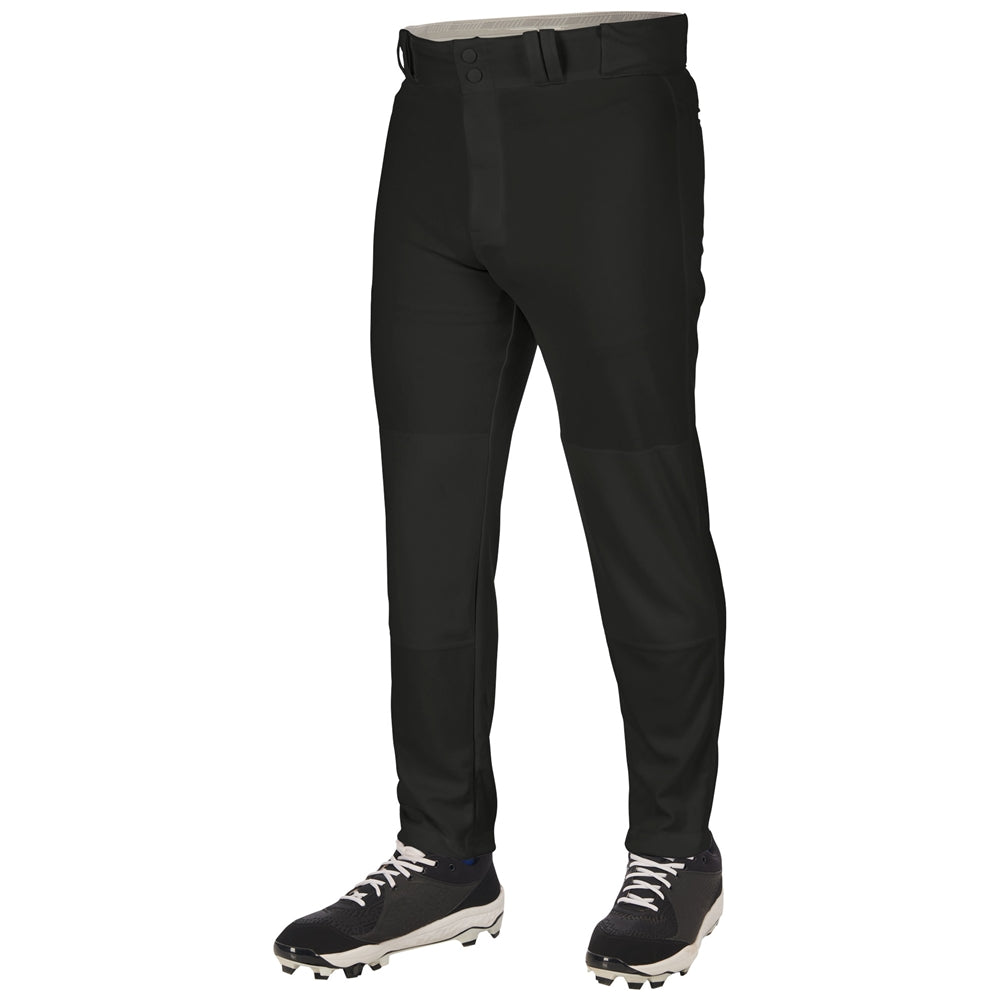 A person wears Champro Sports Youth Triple Crown 2.0 Tapered Baseball Pants (BP64Y) and black-and-white cleats, standing against a plain white background. Only the lower body is visible; the pants feature a tapered fit.