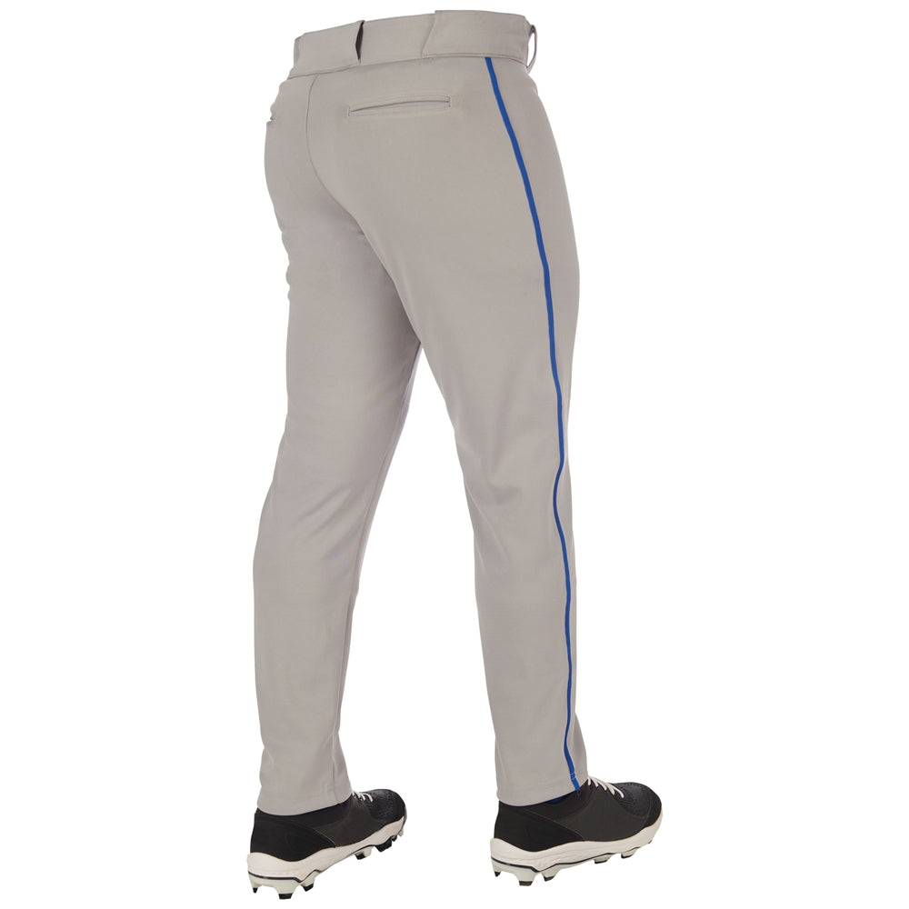 A person wearing Champro Sports Adult Triple Crown 2.0 Tapered Baseball Pants with blue piping (BP66), made from pro-weight fabric, stands with their back to the camera in black cleats.