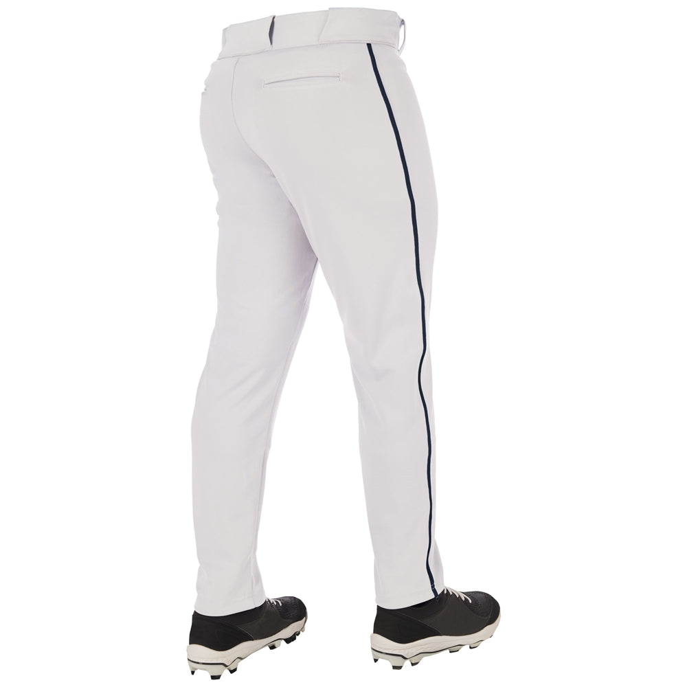 A person is seen from the back wearing Champro Sports Adult Triple Crown 2.0 Tapered Baseball Pants with Piping (BP66) in white with a dark side stripe, paired with black-and-white cleats.