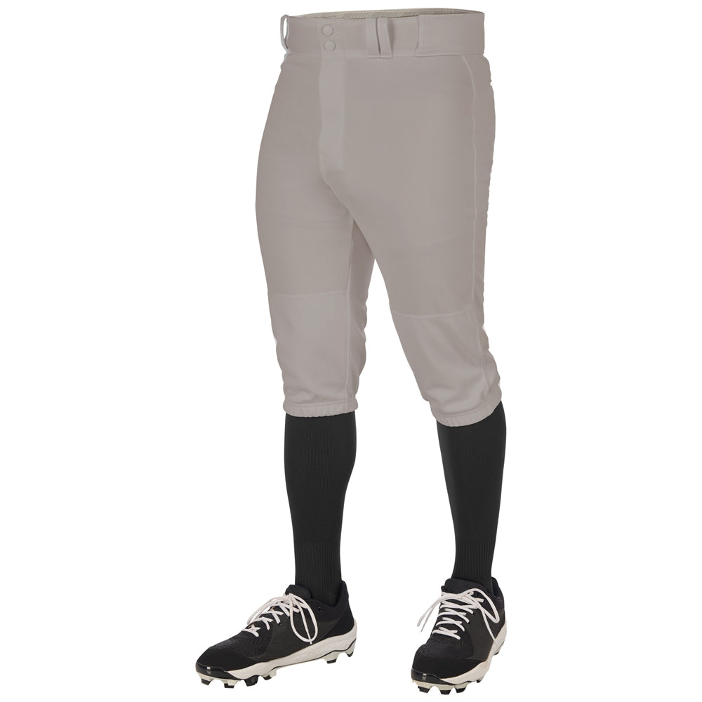 A person is shown from the waist down against a plain white background wearing Champro Sports Adult Triple Crown 2.0 Knicker Baseball Pants (BP68) in gray, paired with black knee-high socks and black cleats with white accents.