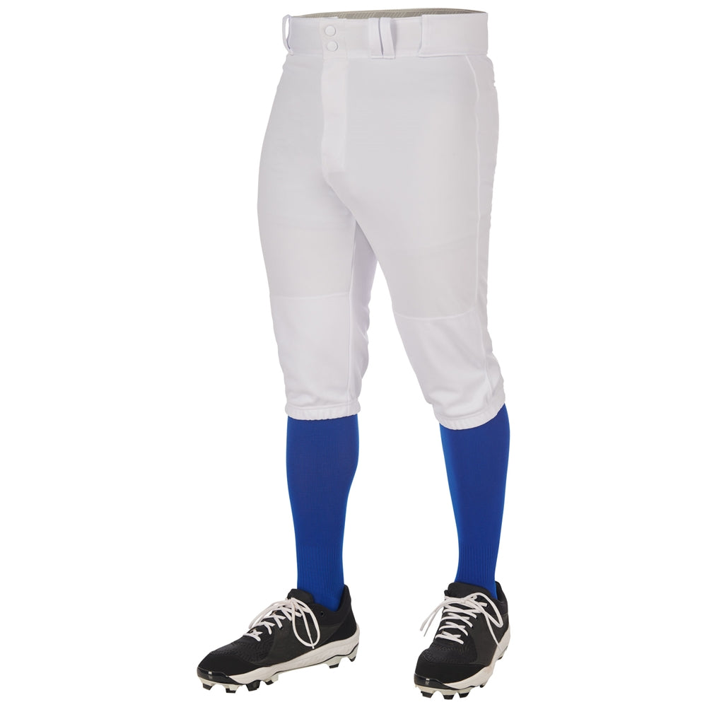 A person shown from the waist down against a white background wears Champro Sports Youth Triple Crown 2.0 Knicker Baseball Pants (BP68Y) with blue knee-high socks, black cleats, and a white belt.