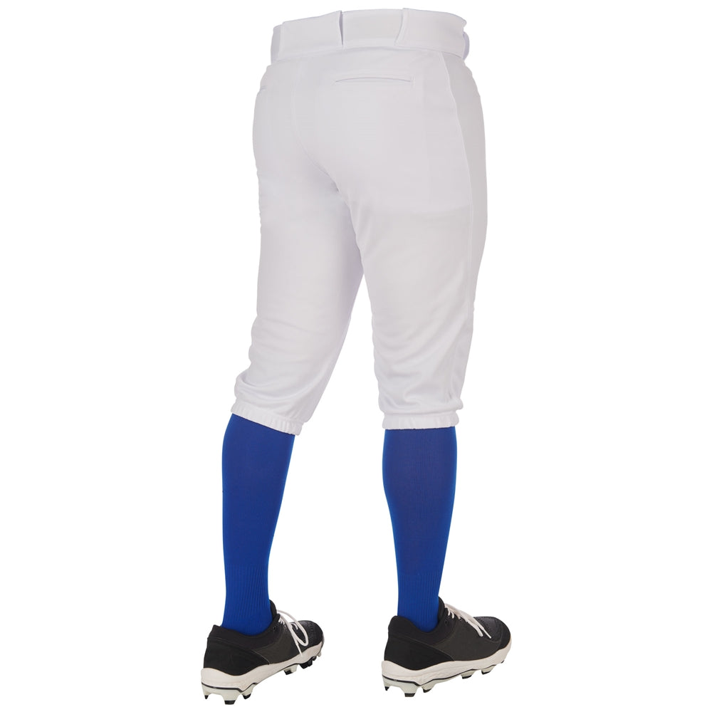 A person wearing Champro Sports Adult Triple Crown 2.0 Knicker Baseball Pants (BP68), blue knee-high socks, and black cleats is standing with their back to the camera.