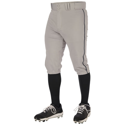 Wearing Champro Sports Youth Triple Crown 2.0 Knicker Baseball Pants with Piping (BP70Y) in gray, black knee-high socks, black and white cleats, and a matching belt; standing against a white background with upper body not visible.
