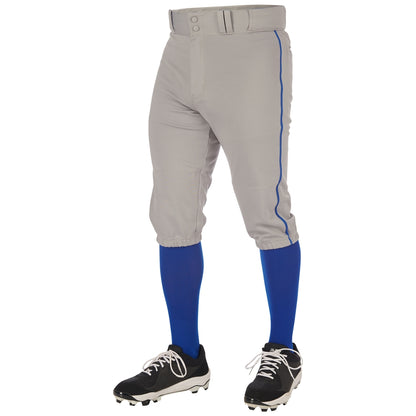 A person wearing Champro Sports Youth Triple Crown 2.0 Knicker Baseball Pants with Piping (BP70Y).