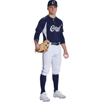 A baseball player in a navy and white "Central" uniform stands holding a glove and ball, wearing a cap, Champro Sports Youth Triple Crown 2.0 Knicker Baseball Pants with Piping (BP70Y), high socks, and cleats against a white background.