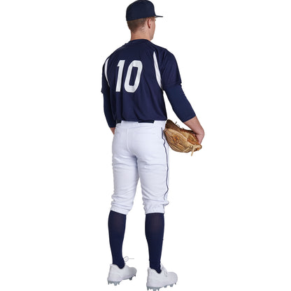 A baseball player faces away, wearing a navy jersey with number 10, Champro Sports Youth Triple Crown 2.0 Knicker Baseball Pants with Piping (BP70Y), navy socks, white cleats, a navy cap, and holding a baseball glove in his left hand.
