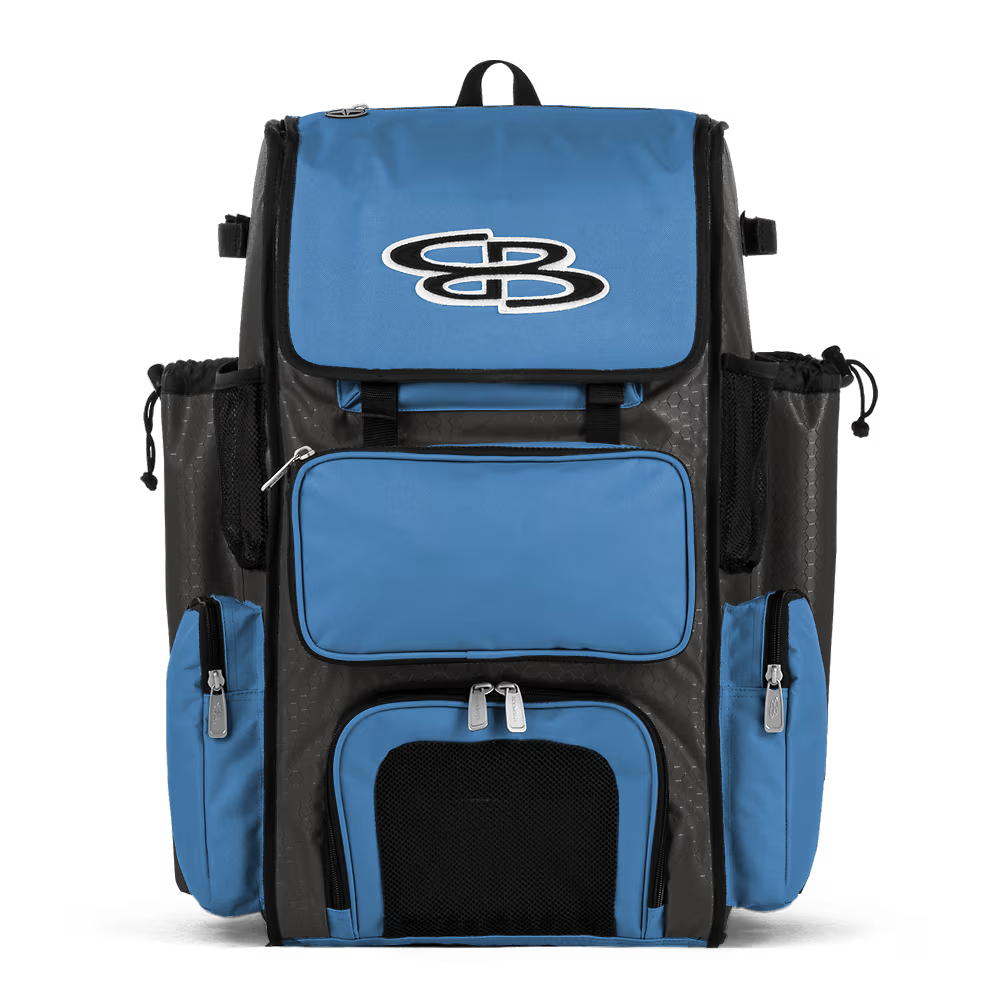 The Boombah Superpack Bat Bag: BPSP by Boombah features blue and black colors, multiple zippered compartments, mesh side pockets, and a white embroidered "SB" logo on the front flap. The backpack stands upright against a plain white background.