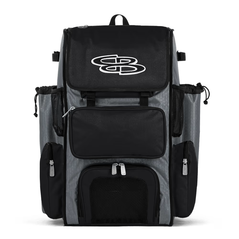 The Boombah Superpack Bat Bag: BPSP by Boombah, in gray-black, features multiple zippered compartments, mesh side pockets, and a white stylized logo on the front flap, shown against a white background.