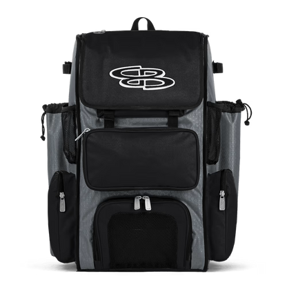 The Boombah Superpack Bat Bag: BPSP by Boombah, in gray-black, features multiple zippered compartments, mesh side pockets, and a white stylized logo on the front flap, shown against a white background.