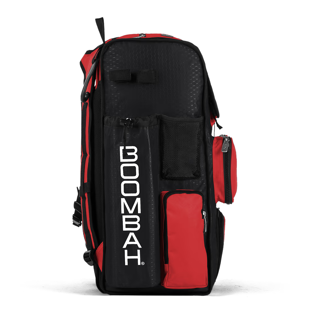 The Boombah Superpack Bat Bag: BPSP by Boombah stands upright in black and red, with multiple zippered compartments and a bold vertical BOOMBAH logo in white on the front pocket.
