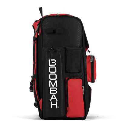 The Boombah Superpack Bat Bag: BPSP by Boombah stands upright in black and red, with multiple zippered compartments and a bold vertical BOOMBAH logo in white on the front pocket.