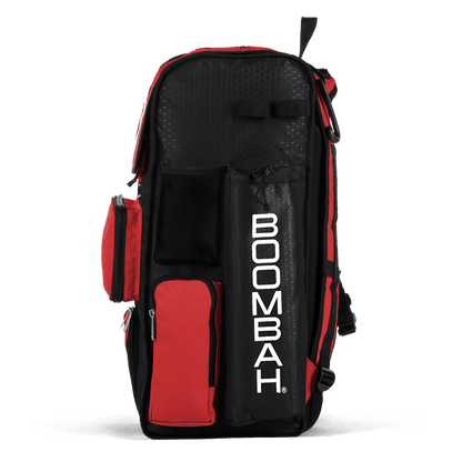 The Boombah Superpack Bat Bag: BPSP by Boombah is a spacious black and red backpack with multiple zippered compartments, mesh pockets, and "BOOMBAH" printed vertically in white on the side.