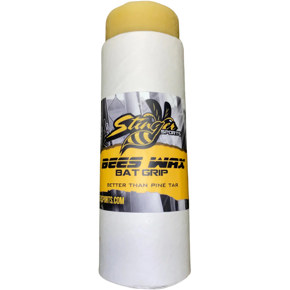 A cylindrical container labeled Stinger Sports Stinger BEES WAX Bat Grip: BEESWAX, featuring a yellow cap and bee graphic, serves as a natural bat grip and pine tar alternative.