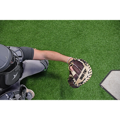 A person wearing the All Star S7 Elite 34" Baseball Catcher's Mitt: CM5000, featuring deep pocket construction.