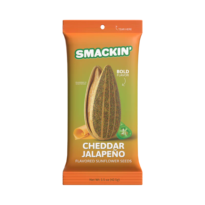 An orange 1.5oz bag of Smackin' Sunflower Seeds features jumbo seeds with cheddar cheese and jalapeño slice graphics, plus bold flavor text.