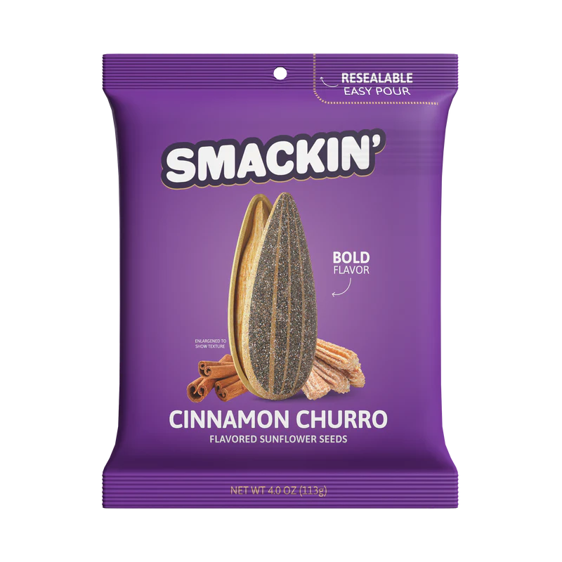 A 4oz resealable purple bag of Smackin' Sunflower Seeds - Cinnamon Churro flavor, featuring jumbo seeds, cinnamon sticks, and bold Smackin' Sunflower Seeds branding on the front.
