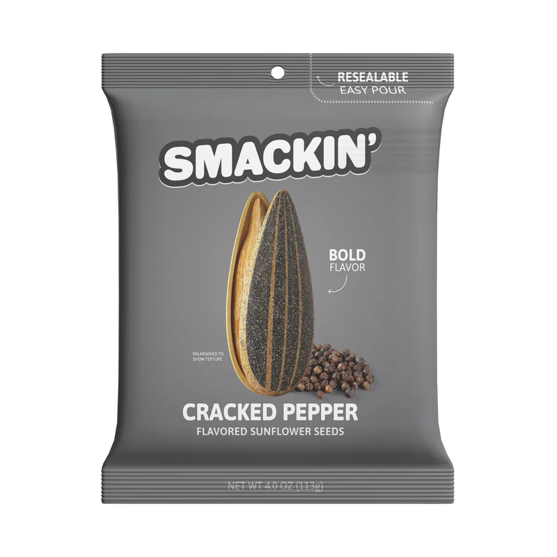 The 4oz Smackin' Sunflower Seeds - Cracked Pepper comes in a gray resealable bag with a sunflower seed and peppercorns featured on the front. Bold Flavor is highlighted, and the net weight is 4.0 oz (113g). Brand: Smackin' Sunflower Seeds.