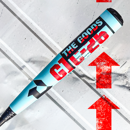 A close-up of the 2026 DeMarini The Goods (-3) BBCOR Baseball Bat: WBD2588010, featuring its X14 Alloy Barrel and labeled GT 1.0, rests diagonally on a white surface with three large red arrows pointing upward.
