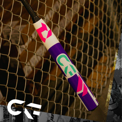 A close-up of a vibrant jump rope handle, featuring pink, green, and purple geometric designs, hangs by a wire fence. The CKF logo appears in the corner, echoing the colorful style of the DeMarini CF (-11) Fastpitch Softball Bat: WBD2630010.