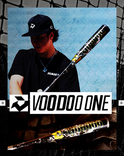 A person in a black hat and shirt holds the 2027 DeMarini Voodoo One (-3) BBCOR Baseball Bat (WBD2705010) by a chain-link fence, with a close-up of its X14 Alloy Barrel and "VOODOO ONE" text displayed across the center.