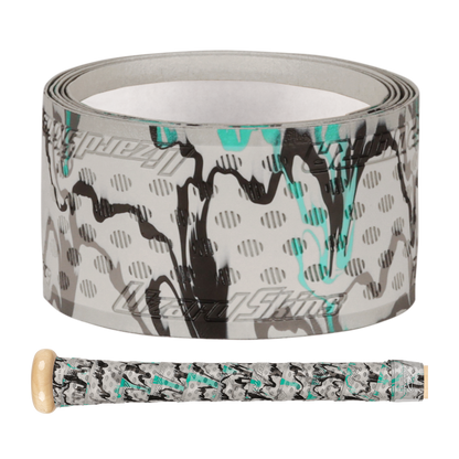 A roll of Lizard Skins DSP Ultra Camo 1.1mm Bat Grip with abstract black, gray, and teal patterns sits beside a wooden bat handle wrapped in the same grip, creating a sleek and stylish look.