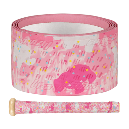 The Lizard Skins DSP Ultra Outburst 1.1mm Bat Grip in Frosted Cookies features pastel colors, fun shapes, and sprinkle patterns, shown on a close-up baseball bat handle, highlighting durable polymer by Lizard Skins.