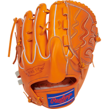 An orange Rawlings Heart of the Hide 11.75" Japan Series Baseball Glove (GH3FHPA15W) features white stitching, wing tip design, a blue/red Rawlings patch by the wrist, and premium U.S. Steerhide leather. Palm down on a white background.