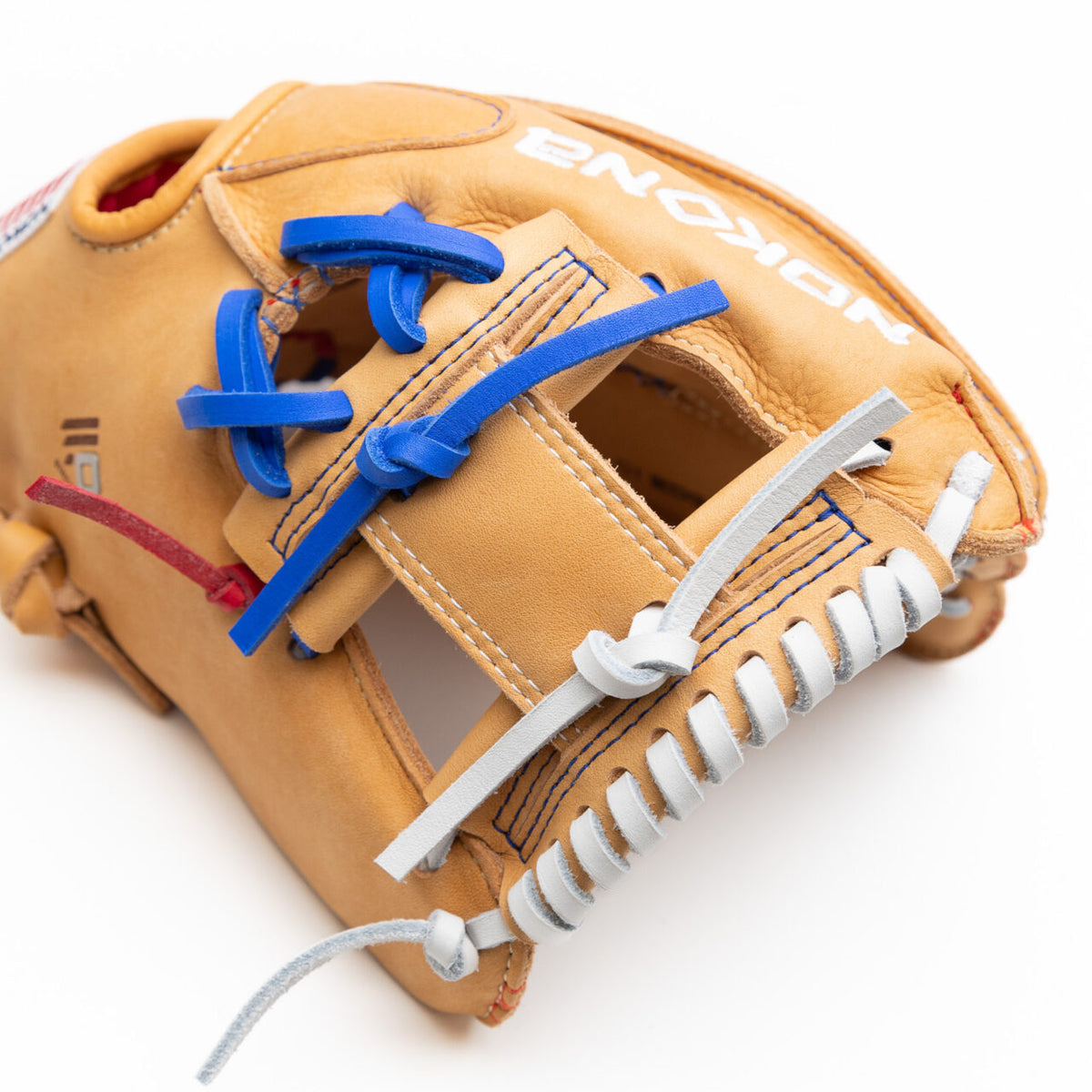 Nokona S1 All-American 11.5″ Baseball Glove: S1-EP400POP tan youth infield glove featuring blue laces at the fingers and white lacing along the edge.
