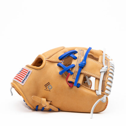 Tan Nokona S1 All-American 11.5″ Baseball Glove S1-EP400POP with blue laces, white lacing along the pocket, and an American flag patch on the thumb.