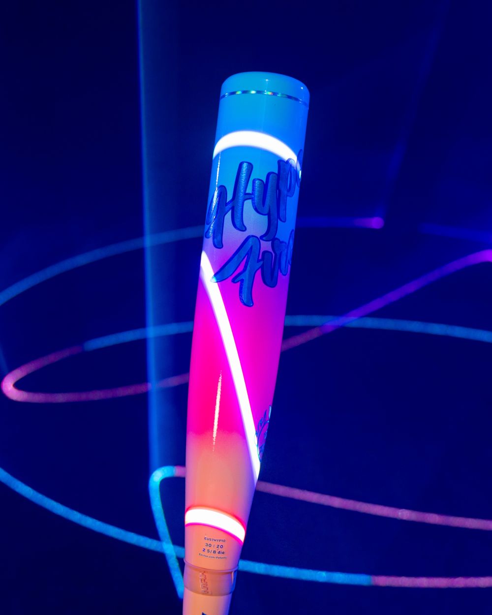 A vibrant baseball bat featuring the Easton logo and “Hype Fire” text glows under neon lights, encircled by blue and pink light trails against a dark background. Inspired by the cutting-edge 2027 Easton Hype Fire (-11) 2 5/8″ USA Baseball Bat: EUS7HYP11 and advanced 3D Ropecoil Composite technology, this bat showcases dynamic style with top-tier performance from Easton.