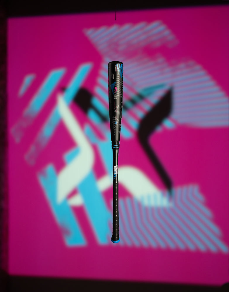 A bat in the air, like the 2024 AXE Avenge Pro 3 Hybrid (-8) 2 5/8" USA Baseball Bat: L174M, from AXE, delivers impressive power and precision.