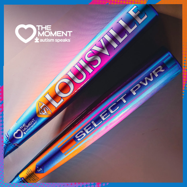 The 2026 Louisville Slugger Select PWR Love the Moment (-3) BBCOR Baseball Bat features a heart logo for Autism Speaks and The Moment campaign in bold blue, purple, orange, and pink—uniting standout style with support for a cause.