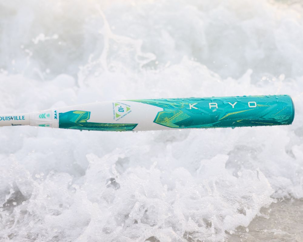 A 2026 Louisville Slugger Kryo (-8) Fastpitch Softball Bat (WBL4137010) floats in the water, its barrel glimmering just below the surface.