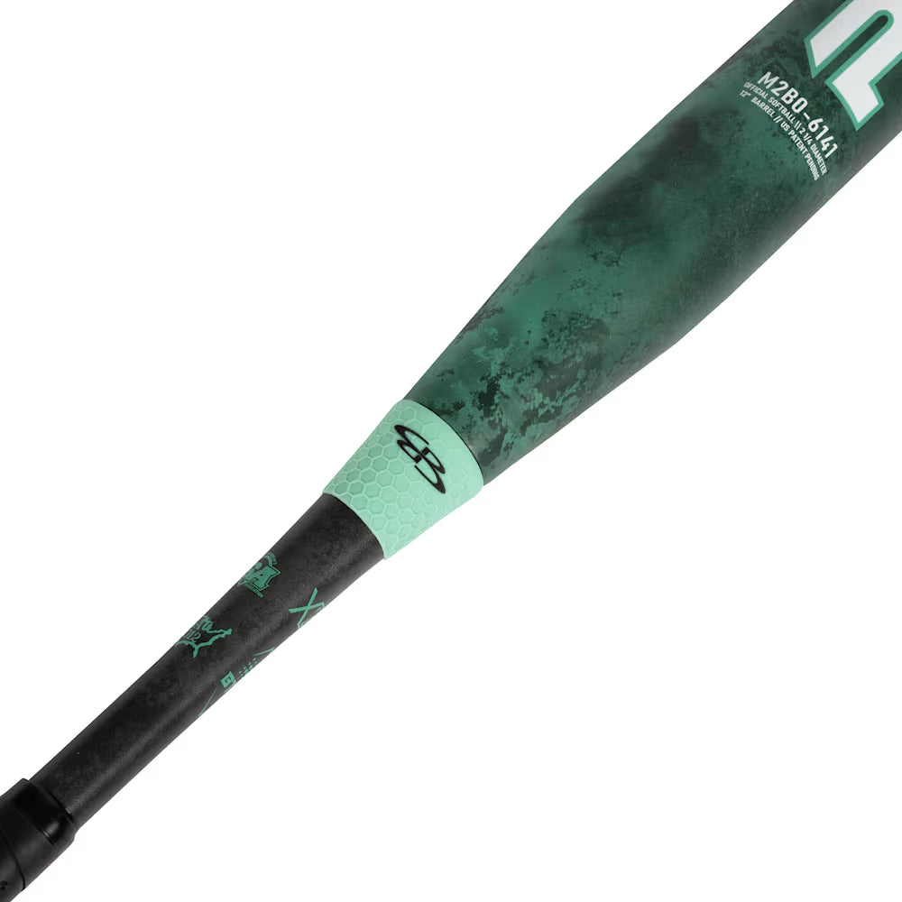 A close-up of the Boombah 2026 Pure12 Teal Control 12" Balanced Slowpitch Softball Bat shows its green and black textured grip, white logos near the end, and a marbled barrel with advanced X25 Barrel Technology.