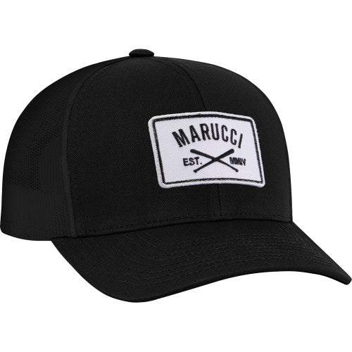 The Marucci Cross Patch Snapback Hat (MAHTTRPCS) is a black snapback with a curved brim, trucker mesh back, and a white front patch featuring the Marucci logo, two crossed bats, and "EST. MMIV" in black lettering.