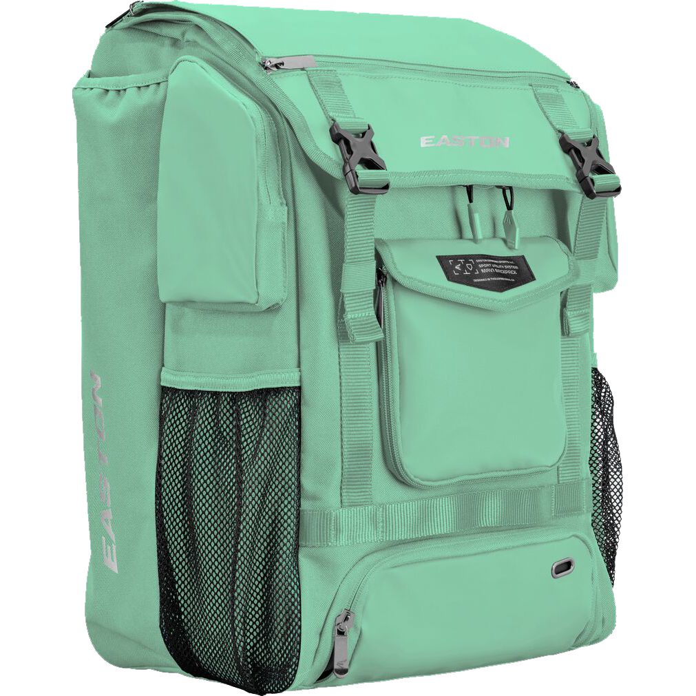 The Easton MAV1 Backpack (MAV1BP) in mint green features multiple compartments, zippered pockets, mesh side pockets, and black buckles. Designed as an ideal baseball gear bag, it includes dedicated bat sleeves for convenient storage. The Easton brand name is displayed on the top flap and side.