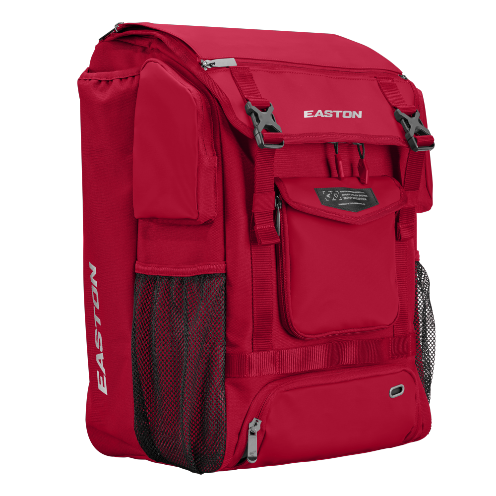 The Easton MAV1 Backpack (MAV1BP) is a high-capacity red gear bag with multiple zippered compartments, mesh side pockets, and adjustable straps, perfect for carrying athletic equipment.
