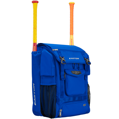 A bright blue Easton MAV1 Backpack (MAV1BP) with mesh side pockets, multiple front zippered compartments, and two yellow-orange bats sticking out—an ideal high-capacity gear bag for players.