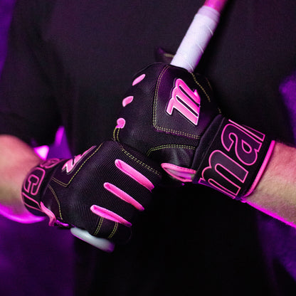 A person wearing Marucci Blacksmith V2 Full Wrap Adult Batting Gloves (MBG2BKSM) grips a baseball or softball bat with both hands, standing against a purple-lit background.