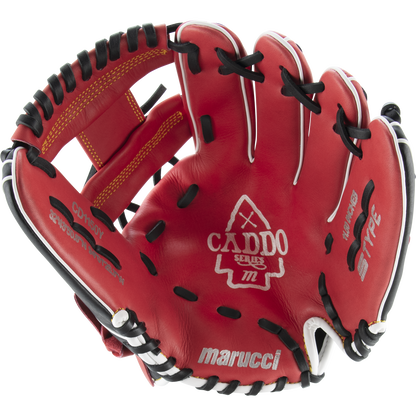 The Marucci Caddo 11.5" Baseball Glove (MFG2CD1150) features red leather with black and white accents, visible stitching, embossed Marucci branding on the palm, an open design showing its interior, finger slots, and adjustable fit.