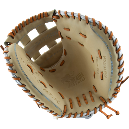 A close-up of an open tan and brown Marucci Acadia 230C2 33.5" Fastpitch Catcher's Mitt (MFG3AC230C2FP-CM), showing the Marucci branding and detailed glove markings stamped on the palm.
