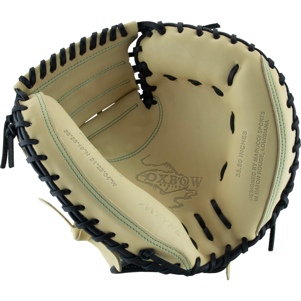 The Marucci Oxbow 235C1 33.5" Baseball Catcher's Mitt features tan and black full-grain cowhide leather, visible stitching, professional-grade rawhide laces, and "Oxbow" printed inside the palm.