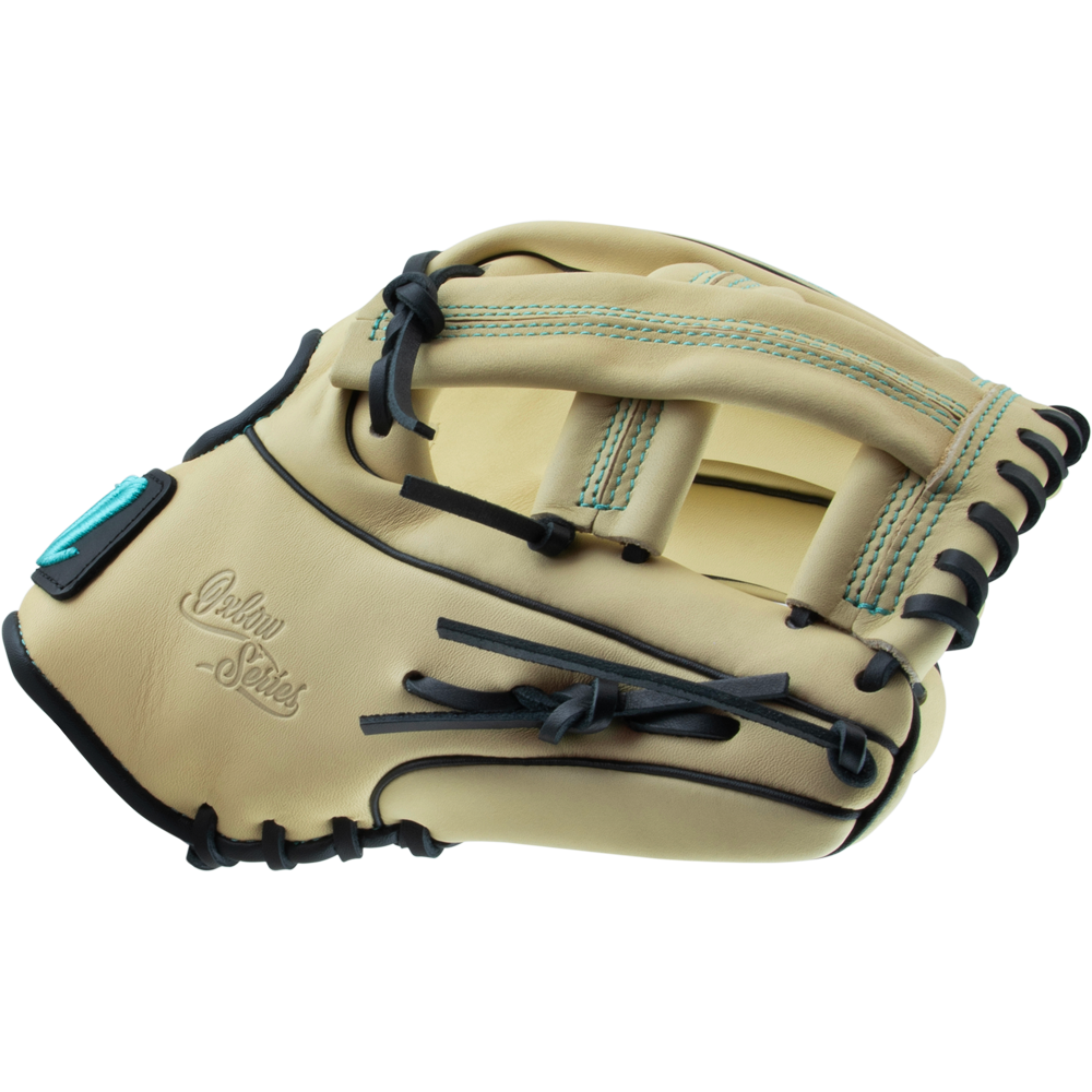 The Marucci Oxbow 44A4 11.75" Baseball Glove features tan full-grain cowhide leather, black laces, teal stitching accents, and the Marucci logo embossed on the palm.