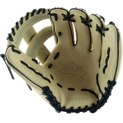 The Marucci Oxbow 44A4 11.75" Baseball Glove (MFG3OX44A4) by Marucci is cream-colored with black laces, visible stitching, Oxbow branding on the palm, and crafted from full-grain cowhide leather.